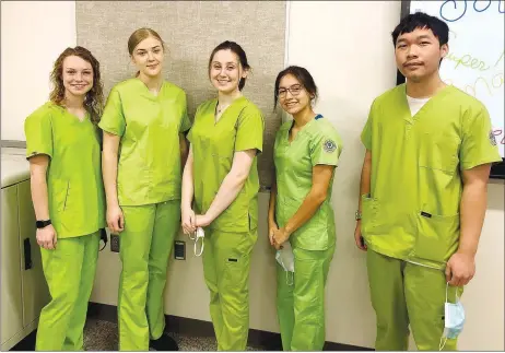  ?? Submitted/LONNIE MOLL ?? Josie Newsom (left), Cora Bass, Ambry Smith, Ithzel Martinez and Dylan Her, students in the CNA and PCA classes at Gentry High School, recently passed their CNA licensure knowledge and skills tests and are now licensed CNAs in the state of Arkansas. The CNA and PCA classes are taught by LPN Lonnie Moll in the career and technical training building at Gentry High School.