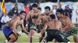  ??  ?? WAH: This file photograph taken on May 6, 2016, shows an Indian kabaddi player (L) as he attempts to tag a Pakistani opponent during their final match of the 3rd Asian Kabaddi Circle Style Championsh­ip 2016 in Wah some 45 kilometers from Islamabad. The...
