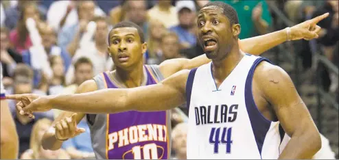  ?? Rob Schumacher / Associated Press ?? Phoenix Suns’ Leandro Barbosa, left, and Dallas Mavericks’ Adrian Griffins disagree over who has the ball in the fourth quarter of Game 5 of the Western Conference finals at American Airlines Center in Dallas on June 1, 2006.