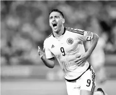  ??  ?? Colombia’s Radamel Falcao celebrates after scoring against Paraguay during their 2018 World Cup football qualifier match in Barranquil­la, Colombia, on October 5, 2017. - AFP photo