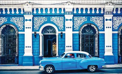  ??  ?? IN THE DRIVING SEAT: A trip to the vibrant cities of Cuba could also include your choice of coastal B&Bs