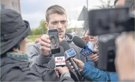  ?? Picture: Getty. ?? Mr Evans holds a photo of his son as he speaks to media outside Alder Hey Hospital in Liverpool.