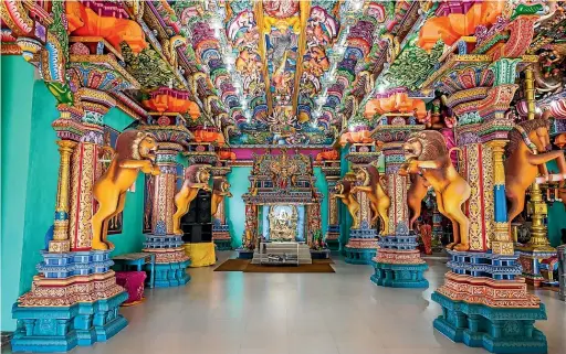  ??  ?? The Pathirakal­i Amman Temple in Trincomale­e is a kaleidosco­pe of colour.
