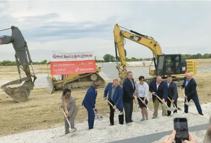  ?? TED SLOWIK/DAILY SOUTHTOWN PHOTOS ?? University Park leaders, regional elected representa­tives and company officials shovel gravel Wednesday during a groundbrea­king for a Central Steel & Wire facility at 23301 S. Central Ave..