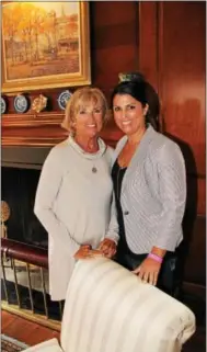  ??  ?? Wayne residents Donna Lewis and Heather Yocum peruse the formal living room of a Berwyn Mansion built in the early 1930s.