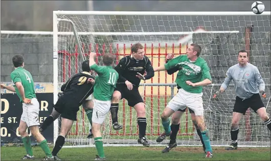  ?? PICTURE: JOHN REIDY ?? Ballymac Galaxy goalkeeper, Alan Mason, keeps a close eye on thie situation as his defenders, Pádraig Mccarthy (9) and Tom Canty, try to hold out Castleisla­nd attackers, from left, Maurice Hickey, Shane O'loughlin and Aiden O'callaghan during Sunday's...