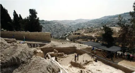  ??  ?? PEOPLE STAND at an excavation site in Jerusalem’s Old City, part of the heritage of Jewish civilizati­on that dates back thousands of years.