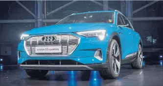  ?? DAVID PAUL MORRIS BLOOMBERG ?? On Monday, German automaker Audi AG revealed the production version of its electric SUV, called the e-tron.