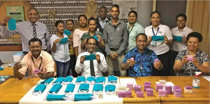  ?? Photo: Ministry of Youth and Sports ?? Representa­tives from the Ministry of Youth and Sports and the Labasa District Youth Council hand over the masks and soap to representa­tives from the Ministry of Health and Medical Services in the Northern Division.