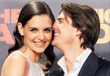  ?? AFP ?? HAPPIER TIMES: In this photo dated June 16, 2010, Tom Cruise and his wife Katie Holmes enjoy a sweet moment on the red carpet of an internatio­nal film premiere in Spain.