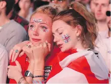  ?? MATT DUNHAM, THE ASSOCIATED PRESS ?? England soccer fans in Hyde Park in London react after watching their team lose the semifinal match against Croatia on Wednesday.