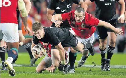  ?? /AFP ?? Exciting talent: Jordie Barrett bursts through the Lions defence in Saturday’s third Test. Barrett was one of All Blacks coach Steven Hansen’s inspired new picks during the series.