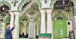  ?? ANI ?? A worker sanitising a mosque in Bengaluru on Saturday ahead of its reopening. n