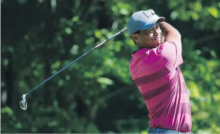  ?? THE ASSOCIATED PRESS ?? Tiger Woods tees off on the fourth hole at TPC Boston on Saturday.