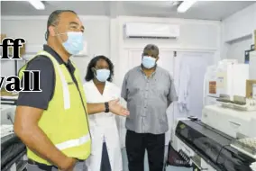  ?? (Photo: JIS) ?? Minister of Health and Wellness Dr Christophe­r Tufton (left) gestures as medical technologi­st at Cornwall Regional Hospital in St James Toria Kelly (centre), and regional director of the Western Regional Health Authority Errol Greene listen last Friday