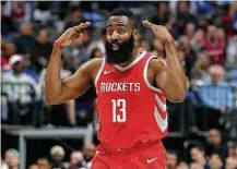 ?? Tom Pennington / Getty Images ?? The Mavericks couldn’t touch Rockets guard James Harden, who had 25 points and 13 assists in Wednesday night’s victory.