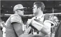  ?? The Associated Press ?? QB CONTRAST: Lions quarterbac­k Matthew Stafford, left, meets with New York quarterbac­k Sam Darnold Monday after the Jets’ 48-17 win Monday in Detroit.