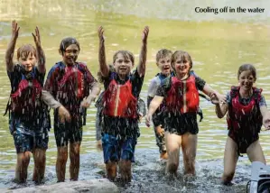  ??  ?? Cooling off in the water