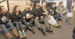  ??  ?? Pols and activists sit in at City Hall on Tuesday to protest homelessne­ss, but their efforts to be arrested came to naught.