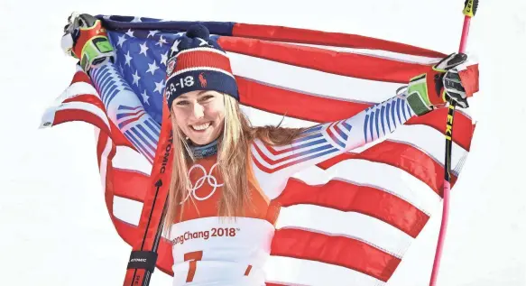  ??  ?? After winning slalom gold in 2014 in Sochi, Mikaela Shiffrin celebrates her victory in the giant slalom Thursday. MICHAEL MADRID/USA TODAY SPORTS