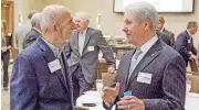  ?? [PHOTO BY ERIECH TAPIA, FOR THE OKLAHOMAN] ?? Ken Moore, left, former Edmond Chamber of Commerce president, speaks with Francis Tuttle President Tom Friedemann at the Edmond Economic Preview.