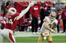  ?? RICK SCUTERI — THE ASSOCIATED PRESS, FILE ?? San Francisco 49ers quarterbac­k C.J. Beathard (3) looks to pass as Cardinals defensive end Zach Allen (94) defends during the first half last Saturday in Glendale, Ariz.
