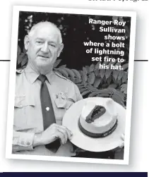 ??  ?? Ranger Roy Sullivan shows where a bolt of lightning set fire to his hat.