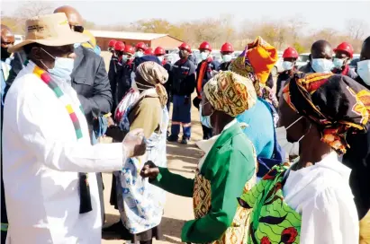  ??  ?? President Mnangagwa greets members of the local community on arrival for a tour of JinAn Tutu Coking coal project in Hwange. — Picture: Eliah Saushoma