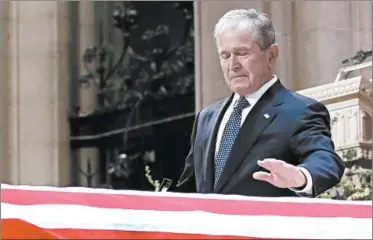  ?? ALEX BRANDON/POOL VIA GETTY-AFP ?? Former President George W. Bush says goodbye to his father at his funeral service.