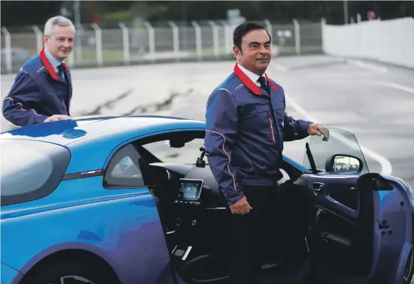  ?? AFP ?? Renault-Nissan chairman Carlos Ghosn, right, and French Economy Minister Bruno Le Maire. The French government may be reluctant to relinquish its Renault stake