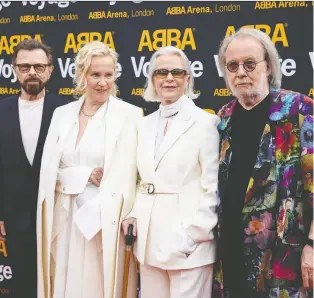  ?? HENRY NICHOLLS/ REUTERS ?? The members of the 1970s Swedish pop band Abba — Björn Ulvaeus, left, Agnetha Fältskog, Anni-frid Lyngstad and Benny Andersson — took a trip back in time when they attended the first performanc­e of the Abba Voyage show in London last week.