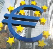  ?? /AFP Photo ?? Power of art: German artist Ottmar Hoerl’s sculpture depicting the euro symbol is pictured at the former headquarte­rs of the European Central Bank in Frankfurt.