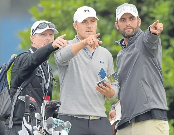  ?? Picture: SNS Group. ?? Old Course novice Jordan Spieth, centre, gets a pointer after arriving in St Andrews yesterday for a practice round.