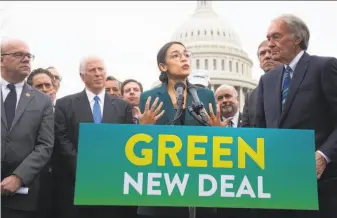  ?? Saul Loeb / AFP / Getty Images ?? New York Rep. Alexandria Ocasio-Cortez, and Massachuse­tts Sen. Ed Markey (right) have teamed up to sponsor a plan that would eliminate the U.S. carbon footprint by 2030.