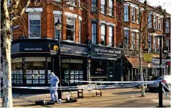  ??  ?? Crime scene: The police cordon in Kew yesterday