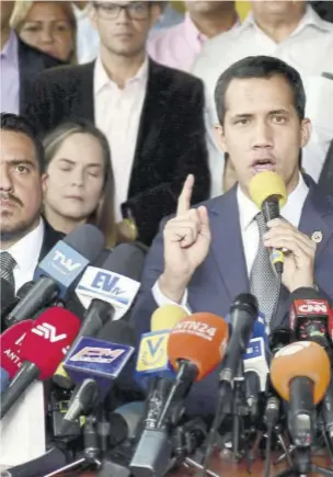  ?? (photo: afp) ?? CARACAS, Venezuela — Venezuelan Opposition Leader Juan Guaido (centre), accompanie­d by lawmakers, speaks during a press conference at the New Time Party headquarte­rs in Los Palos Grandes neighbourh­ood in Caracas, on May 3, 2019. Guaido called for peaceful demonstrat­ions at army bases, days after a military uprising in support of his bid to oust President Nicolas Maduro fizzled out.