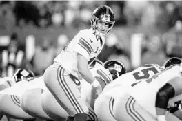  ?? MICHAEL PEREZ/AP ?? New York Giants’ Eli Manning looks for the call against the Philadelph­ia Eagles Monday in Philadelph­ia.