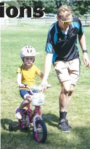  ??  ?? Maggie Fallon learns some basic skills with cycling coach Jake Hallyburto­n during the Ride Nation Gippsland launch in Trafalgar.