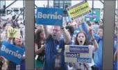  ?? AMY HE / CHINA DAILY ?? Hundreds of Bernie Sanders supporters walk out of the Wells Fargo Center on Tuesday after Hillary Clinton was formally nominated to be the Democratic presidenti­al candidate.
