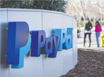  ?? DAVID PAUL MORRIS / BLOOMBERG ?? PayPal shares have climbed by more than 80 per cent this year as more retailers have moved online.