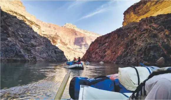  ?? Walter Niklin, The Washington Post ?? The Colorado River looks calm here, but other parts are more formidable— enough to send travelers toppling out of their rafts.