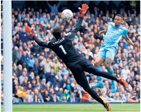  ?? AP ?? Unstoppabl­e:
Manchester City's Gabriel Jesus scores his side's second goal during the Premier League game against Liverpool, at the Etihad stadium in Manchester, England.