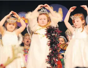  ??  ?? Little angels Pictured from left are Ella Milroy, Farrell Burns and Isla McPheat