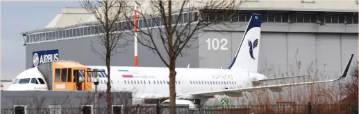  ?? (Fabian Bimmer/Reuters) ?? AN AIRBUS A321 with the Iranian flag and descriptio­n ‘The airline of the Islamic Republic of Iran’ is parked at the Airbus facility in Hamburg yesterday.