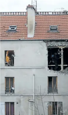  ?? CHRISTOPHE ENA/ THE ASSOCIATED PRESS FILES ?? In this Nov. 19, 2015 file photo, the building of the police raid on an apartment is pictured in Paris suburb Saint- Denis. The presiding judge said the Paris court found Jawad Bendaoud, a 31- year- old street criminal, not guilty of providing lodging...