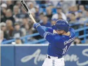  ?? TOM SZCZERBOWS­KI/ GETTY IMAGES ?? Justin Smoak cracks an RBI single in the Blue Jays win over Seattle on Thursday night. The Jays and Mariners play again Friday night.