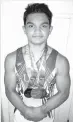  ??  ?? Blake Tingzon proudly displays medals he won in gymnastics competitio­ns. CONTRIBUTE­D PHOTO