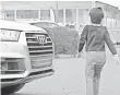  ?? CHRIS WIGGINS, USA TODAY ?? The 2017 Audi Q7 will brake by itself when it senses an object in front of it. Above, it stops short of a dummy.