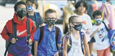  ?? ?? Pandemic school closures and mask restrictio­ns were among the early rumblings of a nowrelentl­ess war of wokeness on kids, authors Bethany Mandel and Karol Markowicz write.