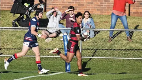  ??  ?? UNSTOPPABL­E: Valleys Roosters fullback Gerome Burns, along with brother Denzel, proved to be more than a handful for the Warwick Cowboys defence.